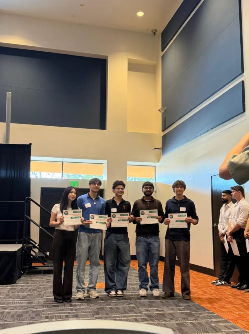 The Nested team holding their 1st place certificates